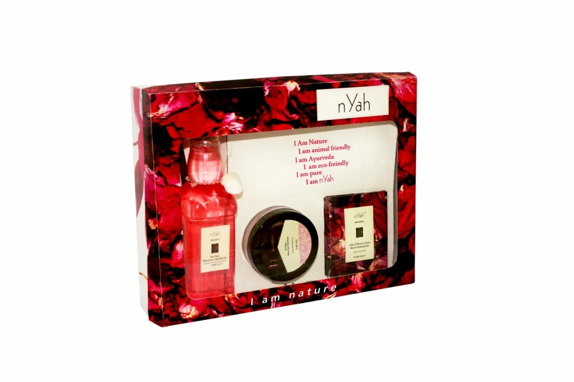 Nyah Large Floral Rose Gift Set – 3-piece, Rectangular red floral gift box with three visible personal-care items, including bottles and a round container.