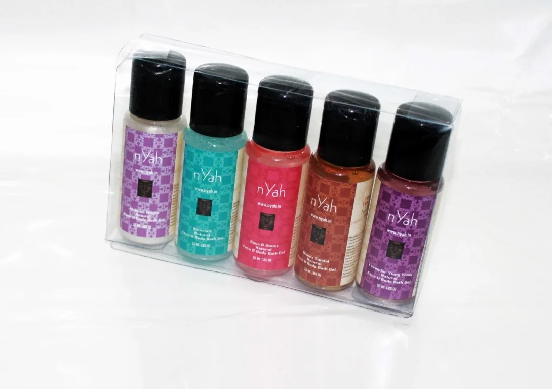 Nyah Small Transparent Box Gift Shower Gels – 5 × 55 ml, Clear presentation box containing five small bottles in different colors.