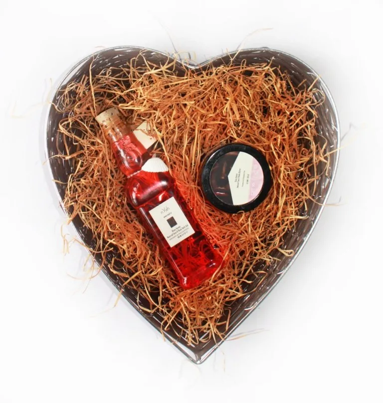 Nyah Luv Basket Gift Rose Set (190 ml), Heart-shaped basket with filler and two visible personal-care products, including a bottle and round container.